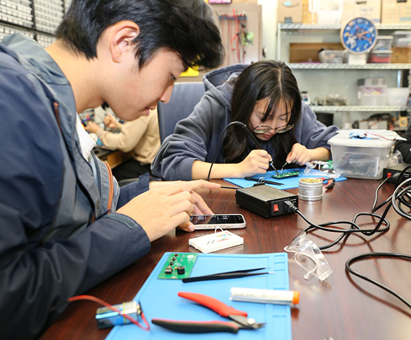 Adam Wu (left) was looking for hands-on experience with computer hardware and found it with the Open Project Space course. 